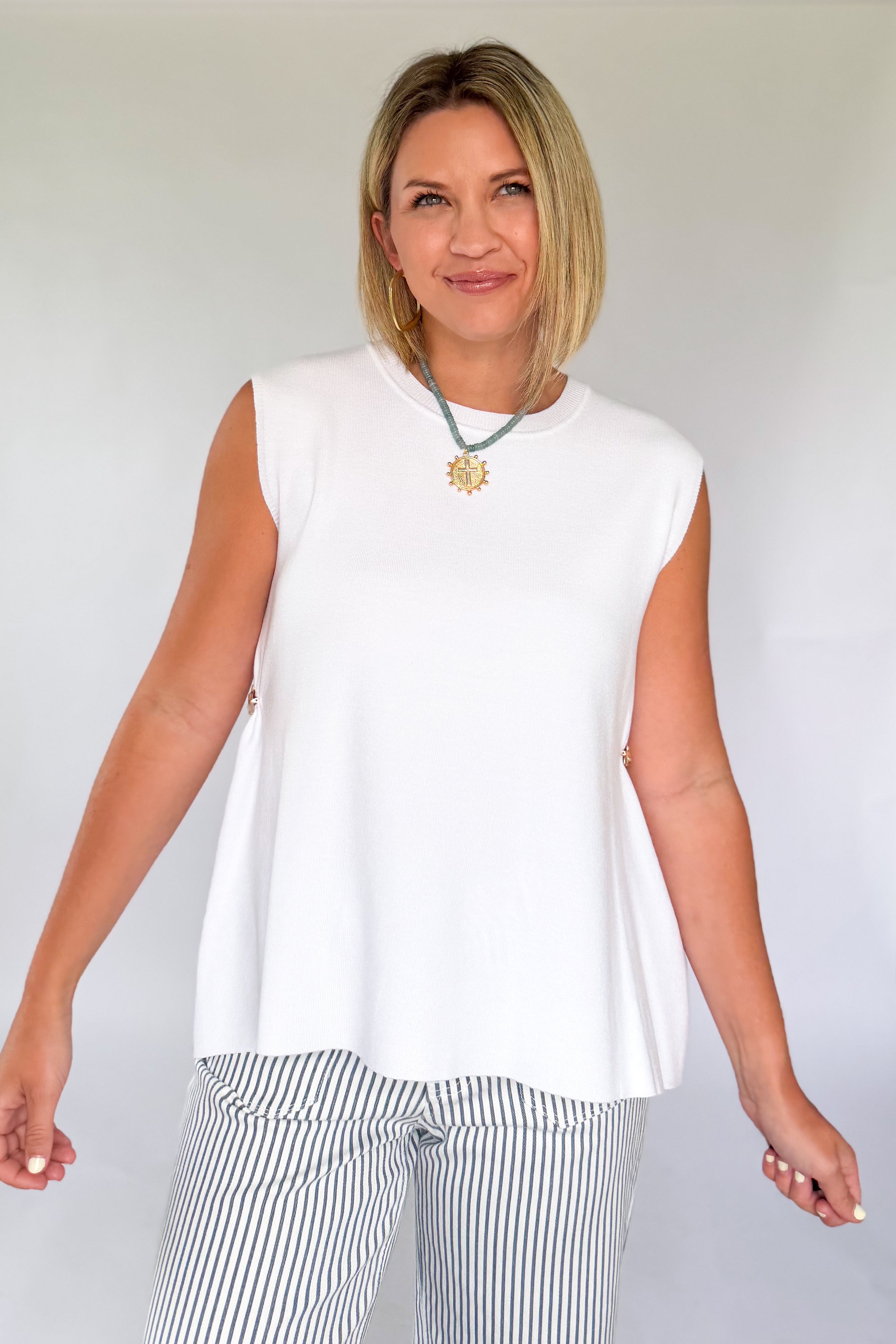 entro white tank with gold detailing on the side