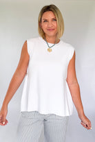 entro white tank with gold detailing on the side